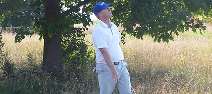 Chris Thompson watches flop shot from way behind 16 green on its way to settling 10 feet from the cup, setting up an up-and-down par. Thompson shot 4-under 67, four strokes off the lead, Thursday in the first day of the KC Golf Classic at Nicklaus Golf Club at LionsGate. (Photo by Tom Keegan)