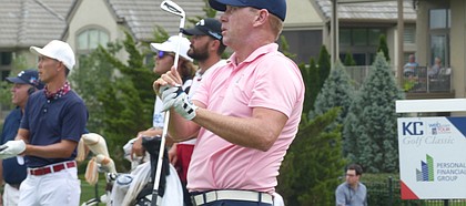 Chris Thompson watches his tee shot at No. 17 at Nicklaus Club at LionsGate come to a rest 2 feet in front of the cup, igniting big ovation from pro-KU crowd. Thompson birdied the final three holes Saturday and enters the final round of the KC Golf Classic in a tie for third. (Photo by Tom Keegan)