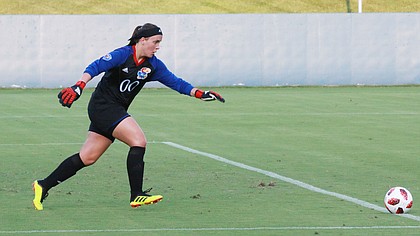 Kansas freshman goalkeeper Sarah Peters sends a kick toward the midfield in the first half. Kansas upset No. 18 Pepperdine 1-0 in its home opener