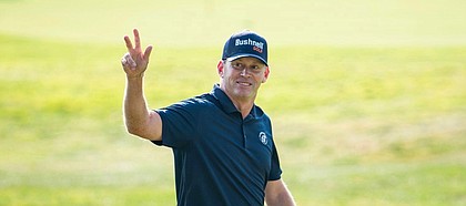 Chris Thompson is all smiles at Pumpkin Ridge in Portland, where he was presented with his first PGA Tour card at the age of 42. (Photo by Hans Ogren)