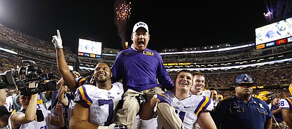 LSU head coach Les Miles is carried off the field after an NCAA college football game against Texas A&M in Baton Rouge, La., Saturday, Nov. 28, 2015. LSU won 19-7. (AP Photo/Jonathan Bachman)