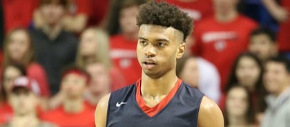 Four-star Little Rock, Ark., point guard Issac "Mackey" McBride brings the ball up the floor and looks to initiate offense during a prep game last season. (Photo by Nick Wenger)