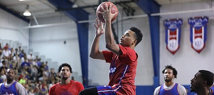 Red Team guard Devon Dotson soars in for a bucket during a scrimmage on Wednesday, June 13, 2018, at the Horejsi Family Athletics Center. (Nick Krug/Journal-World photo)
