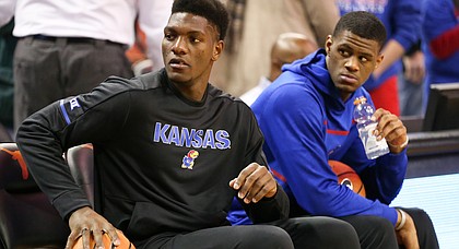 In this file photo from Dec. 29, 2017, Kansas forward Silvio DeSousa, left, sits next to teammate Billy Preston at Frank Erwin Center in Austin, Texas.