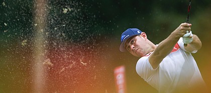 Gary Woodland of the United States of America plays a shot on the eighth hole during third round of the CIMB Classic golf tournament at Tournament Players Club (TPC) in Kuala Lumpur, Malaysia, Saturday, Oct. 13, 2018. (AP Photo/Yam G-Jun)