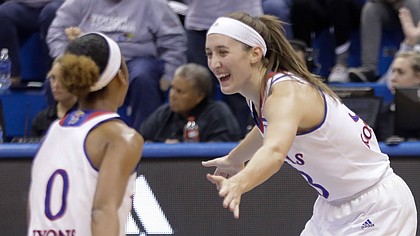 Kansas guard Kylee Kopatich (33) celebrates with a teammate after sinking one of her five first-half 3-point baskets in the Jayhawks' 66-48 win over Campbell on Sunday, Nov. 12, 2017, at Allen Fieldhouse.