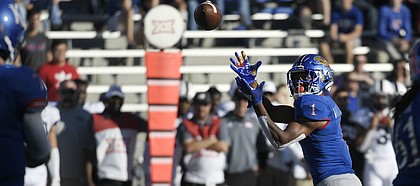 Kansas running back Pooka Williams Jr. reels in a pass from quarterback Peyton Bender Saturday.