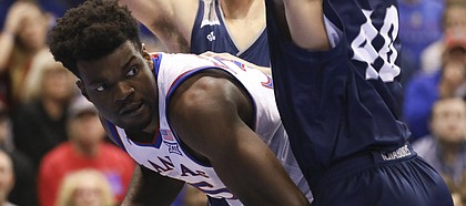 Kansas center Udoka Azubuike (35) is pressured down low by Washburn forward David Salach (40) during the first half of an exhibition, Thursday, Nov. 1, 2018, at Allen Fieldhouse.