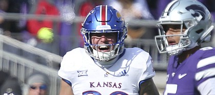 Kansas linebacker Joe Dineen Jr. (29) celebrates a stop before Kansas State quarterback Alex Delton (5) during the second quarter on Saturday, Nov. 10, 2018 at Bill Snyder Family Stadium in Manhattan, Kan.