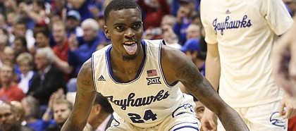 Kansas guard Lagerald Vick (24) sticks out his tongue in celebration after connecting from the corner on a 3-pointer during the second half against Louisiana on Friday, Nov. 16, 2018 at Allen Fieldhouse.