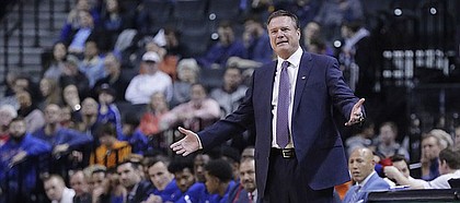 Kansas coach Bill Self gestures during the first half of the team's NCAA college basketball game against Marquette in the NIT Season Tip-Off tournament Wednesday, Nov. 21, 2018, in New York. (AP Photo/Frank Franklin II)