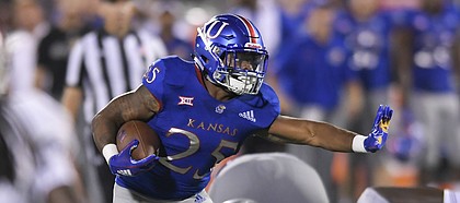 Kansas running back Dom Williams (25) runs against Nicholls State during the second half of an NCAA college football game in Lawrence, Kan., Saturday, Sept. 1, 2018. (AP Photo/Reed Hoffmann)