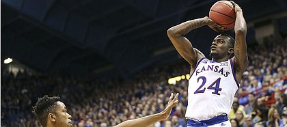 Kansas guard Lagerald Vick (24) lines up a three from the corner against Stanford forward KZ Okpala (0) during the second half on Saturday, Dec. 1, 2018 at Allen Fieldhouse.