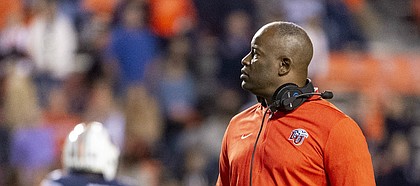 FILE — Liberty head coach Turner Gill looks on during an injury break in the second half of an NCAA college football game against Auburn, Saturday, Nov. 17, 2018, in Auburn, Ala. (AP Photo/Vasha Hunt)