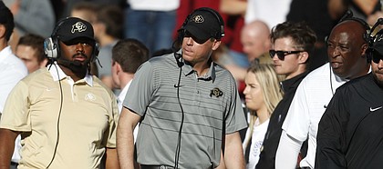 FILE — Former Colorado Buffaloes defensive coordinator D.J. Eliot, center, in the first half of an NCAA college football game Saturday, Nov. 11, 2017, in Boulder, Colo. Eliot agreed in December of 2018 to join the Kansas football program as the defensive coordinator for Les Miles. (AP Photo/David Zalubowski)