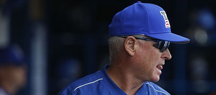 Kansas head coach Ritch Price paces the dugout during the second inning on Tuesday, Feb. 28, 2017.