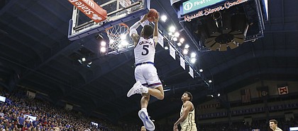 Kansas guard Quentin Grimes (5) gets up for a lob jame against Wofford during the second half on Tuesday, Dec. 4, 2018 at Allen Fieldhouse.