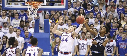 Kansas forward Mitch Lightfoot (44) battles for a rebound with Villanova forward Saddiq Bey (15) during the second half, Saturday, Dec. 15, 2018 at Allen Fieldhouse.