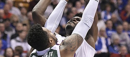 Kansas center Udoka Azubuike was fouled while going up for a shot by Eastern Michigan's James Thompson IV.