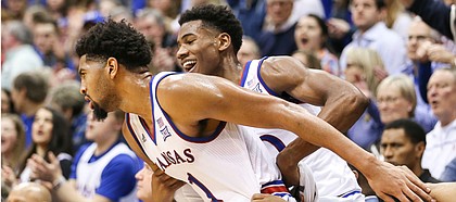Kansas guard Ochai Agbaji (30) helps up Kansas forward Dedric Lawson (1) after Lawson hit a three from the corner during the second half, Wednesday, Jan. 9, 2019 at Allen Fieldhouse.