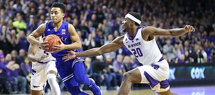 Kansas guard Devon Dotson (11) moves to the bucket past Kansas State forward Xavier Sneed (20) during the first half, Tuesday, Feb. 5, 2019 at Bramlage Coliseum.