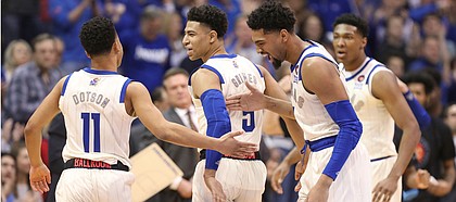 Kansas forward Dedric Lawson (1) and Kansas guard Quentin Grimes (5) congratulate Kansas guard Devon Dotson (11) after Dotson's steal and a bucket during the first half, Saturday, Feb. 9, 2019 at Allen Fieldhouse.