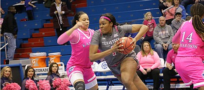 Texas Tech's Erin DeGrate (1) drives past KU senior Chelsea Lott (1) in a game at Allen Fieldhouse, February 17, 2019.