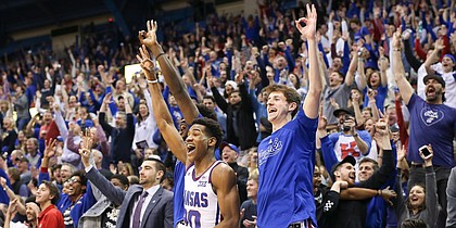 Kansas guard Ochai Agbaji (30) and Kansas guard Garrett Luinstra (20) erupt after a three by Kansas guard Chris Teahan (12) late in the second half, Saturday, Feb. 16, 2019 at Allen Fieldhouse.