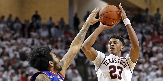 Texas Tech's Jarrett Culver (23) shoots over Kansas' K.J. Lawson (13) during the second half of an NCAA college basketball game Saturday, Feb. 23, 2019, in Lubbock, Texas. (AP Photo/Brad Tollefson)