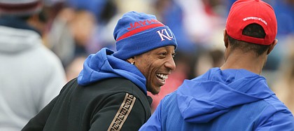 Former Kansas player and Denver Bronco, Chris Harris talks with former teammate Darrell Stuckey prior to kickoff of Late Night Under the Lights on Saturday, April, 13, 2019 at Memorial Stadium.