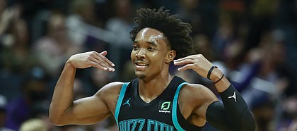 Charlotte Hornets guard Devonte' Graham gestures after making a 3-point basket during the second half of an NBA basketball game against the Orlando Magic on Monday, Dec. 31, 2018, in Charlotte, N.C. The Hornets won 125-100. (AP Photo/Jason E. Miczek)