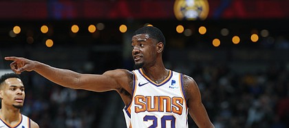 Phoenix Suns forward Josh Jackson (20) in the first half of an NBA basketball game Friday, Jan. 25, 2019, in Denver. (AP Photo/David Zalubowski)