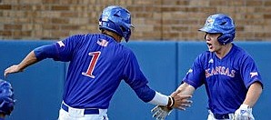 Kansas baseball players Benjamin Sems (1) and Casey Burnham celebrate a run during the Jayhawks' weekend sweep of in-state rival Kansas State at Hoglund Ballpark.