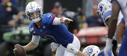 Kansas quarterback Carter Stanley (9) is sacked by Indiana State defensive lineman Henrik Barndt (92) during the second half of an NCAA college football game Saturday, Aug. 31, 2019, in Lawrence, Kan. Kansas won 24-17. (AP Photo/Charlie Riedel)
