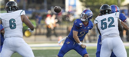 Kansas quarterback Carter Stanley fumbles the ball as he tries to make a pass against Coastal Carolina Saturday night at David Booth Kansas Memorial Stadium on Sept. 7, 2019.