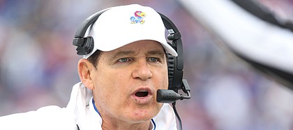 Kansas head coach Les Miles gets the attention of an official during the second quarter on Saturday, Oct. 5, 2019 at Memorial Stadium.