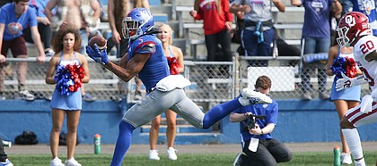 Kansas wide receiver Stephon Robinson Jr. (5) reaches to pull in a touchdown pass during the fourth quarter on Saturday, Oct. 5, 2019 at Memorial Stadium.