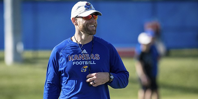 New Kansas offensive coordinator Brent Dearmon cracks a smile during a recent KU football practice. Dearmon was promoted from offensive consultant to O.C. on Sunday, Oct. 6, 2019, and is the process of preparing for his first game in his new role. 