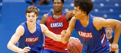 Kansas guard Christian Braun heads up the court with the ball during a scrimmage on Tuesday, June 18, 2019 at Allen Fieldhouse.