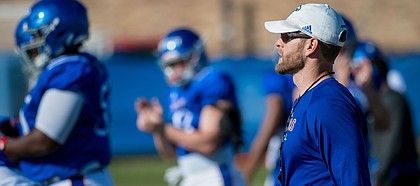 New Kansas offensive coordinator Brent Dearmon watches a play during a recent KU football practice. Dearmon was promoted from offensive consultant to O.C. on Sunday, Oct. 6, 2019, and is the process of preparing for his first game in his new role.