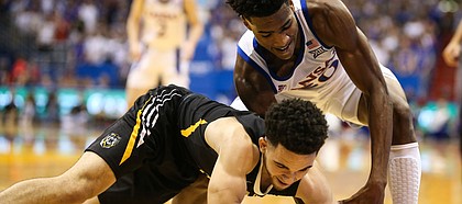 Kansas guard Ochai Agbaji (30) tangles with Fort Hays State guard Aaron Nicholson (1) for a ball in the corner during the first half, Thursday, Oct. 24, 2019 at Allen Fieldhouse.