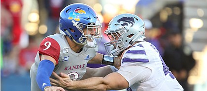 Kansas quarterback Carter Stanley (9) is sacked by Kansas State defensive end Kyle Ball (44) during the fourth quarter on Saturday, Nov. 2, 2019 at Memorial Stadium.