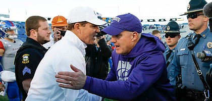 Kansas head coach Les Miles congratulates Kansas State head coach Chris Klieman following the Wildcats' 38-10 win over the Jayhawks on Saturday, Nov. 2, 2019 at Memorial Stadium.