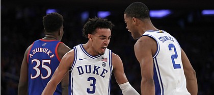 Duke guard Tre Jones (3) and guard Cassius Stanley (2) react after a basket during the second half of the team's NCAA college basketball game against Kansas on Tuesday, Nov. 5, 2019, in New York. (AP Photo/Adam Hunger)