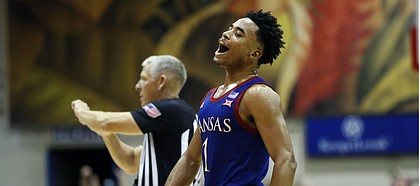 Kansas guard Devon Dotson (1) reacts to play during a timeout against BYU during the second half of an NCAA college basketball game, Tuesday, Nov. 26, 2019, in Lahaina, Hawaii. (AP Photo/Marco Garcia)