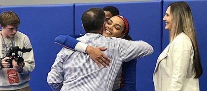 Kansas senior middle blocker Zoe Hill hugs head coach Ray Bechard on KU volleyball's senior night. KU defeated Iowa State 3-2 (25-14, 25-23, 25-22, 26-24, 15-12) on Wednesday, Nov. 27.