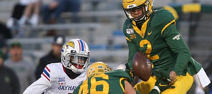 Baylor Bears linebacker Blake Lynch (2) picks off a pass intended for Kansas wide receiver Andrew Parchment (4) during the third quarter on Saturday, Nov. 30, 2019 at Memorial Stadium.