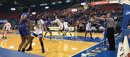Kansas defends an in-bounds play from Florida. KU defeated Florida 76-66 in the Big 12/SEC Challenge on Sunday, Dec. 8.