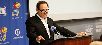 Kansas head football coach Les Miles talks with media members during a signing day press conference on Wednesday, Dec. 18, 2019 in Mrkonic Auditorium.