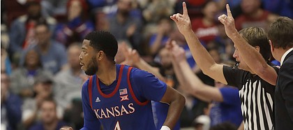 Kansas guard Isaiah Moss (4) runs upcourt after shooting a three-point basket against Stanford during the second half of an NCAA college basketball game in Stanford, Calif., Sunday, Dec. 29, 2019. (AP Photo/Jeff Chiu)